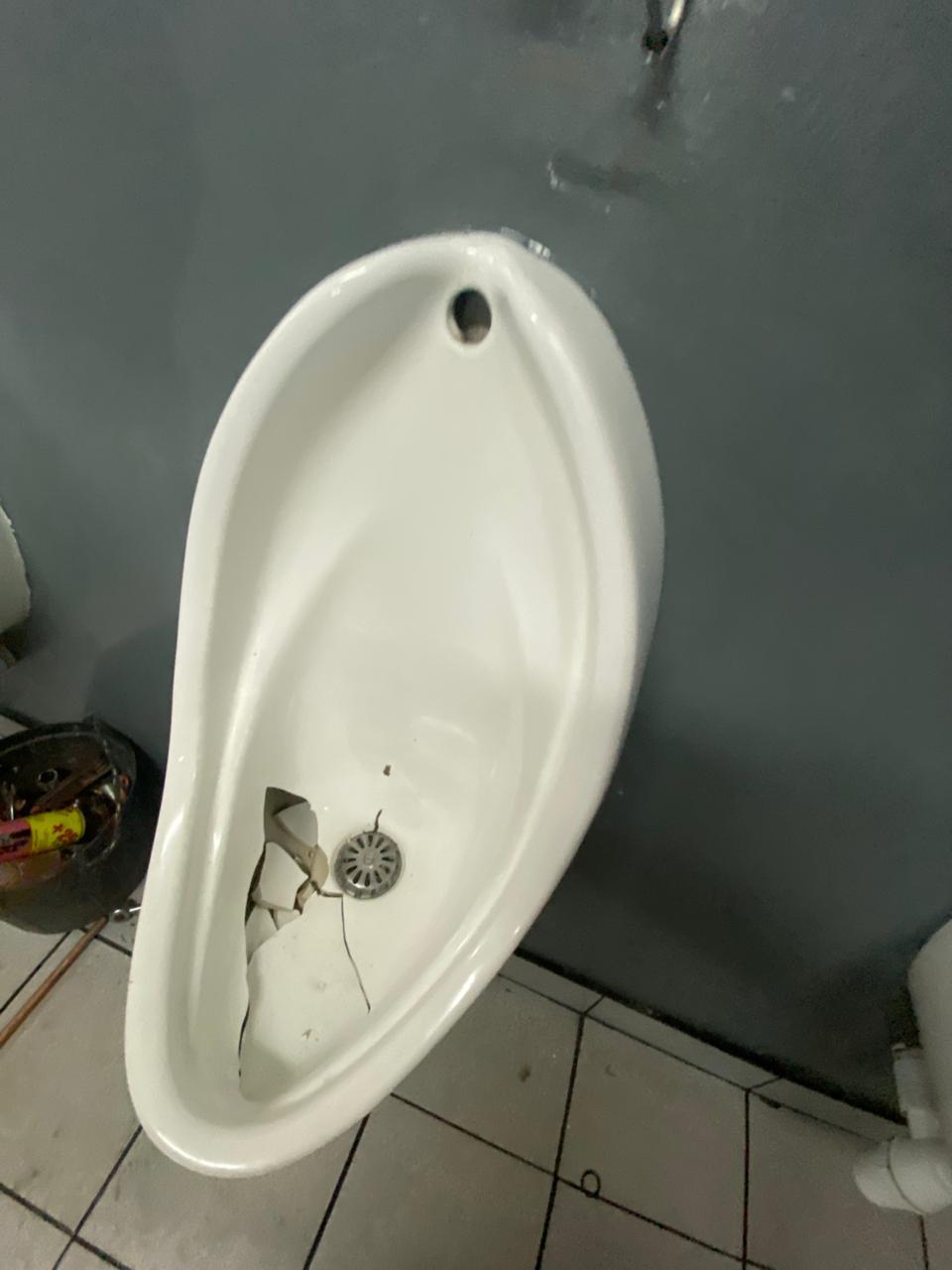 Broken urinal before repair